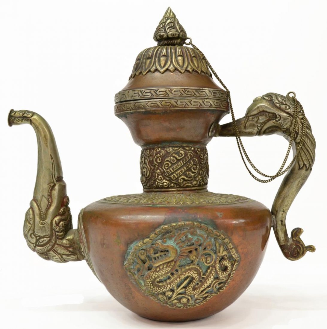 TIBETAN MIXED METAL TEA POT: Tibetan mixed metal tea pot, of bulbous form, lid and base intricately decorated with vertical ribbing, neck banded with scrolls, fish, and buddhist designs, the body with a quatrefoil plaque on eithe