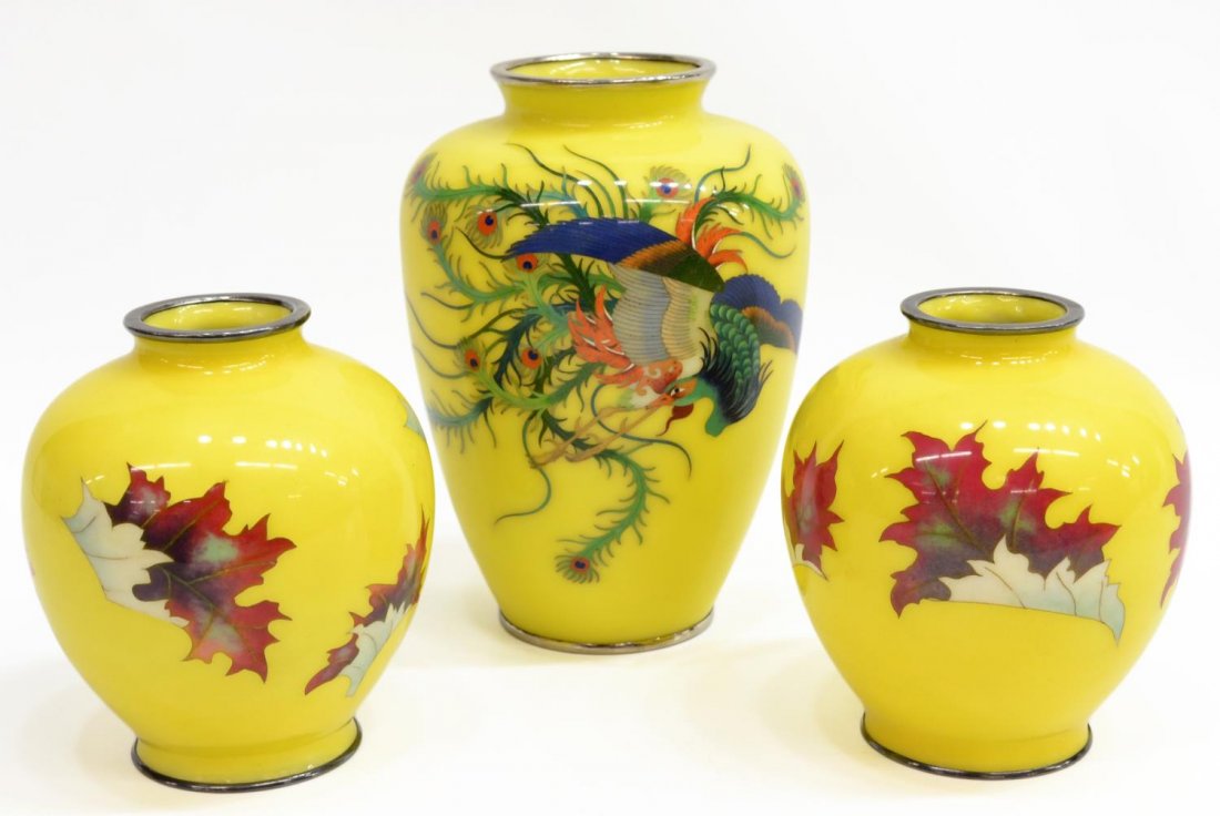 (3) JAPANESE WIRELESS CLOISONNE VASE GROUP: (lot of 3) Japanese wireless cloisonne vases, comprising: (1) of tapering body, the wireless lemon yellow ground decorated to one side with a phoenix in flight in various colors, with a white metal ri