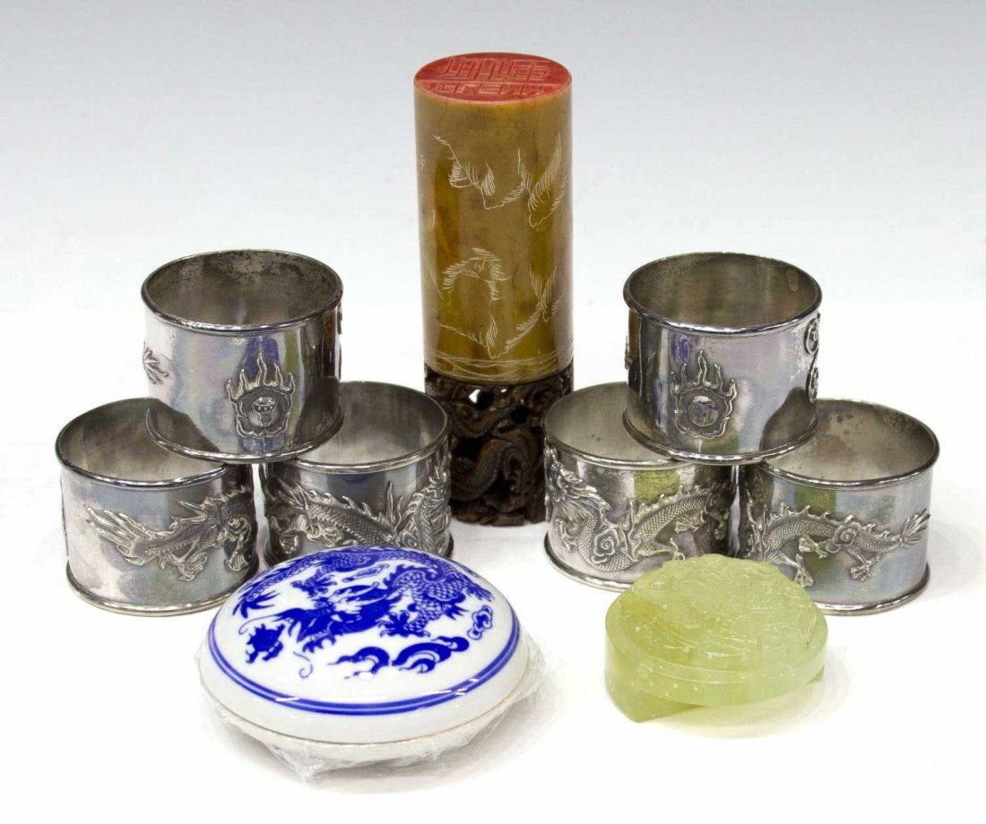 (9) CHINESE DECORATIVE COLLECTIBLE GROUP: (lot of 9) Chinese collectibles including (6) silver plate napkin ring holders, each with relief dragon in pursuit of flaming pearl, dragon carved stamp with name together with porcelain dish with red