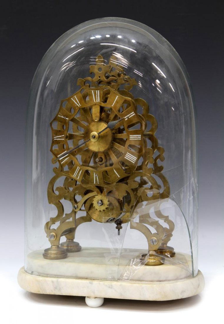 ENGLISH BRASS FUSEE MOVEMENT SKELETON CLOCK: English brass fusee movement skeleton clock, c. 1900, a pierced chapter ring with roman numerals, circular feet, mounted on a marble base covered in a glass dome, damaged dome with loss of glass and t
