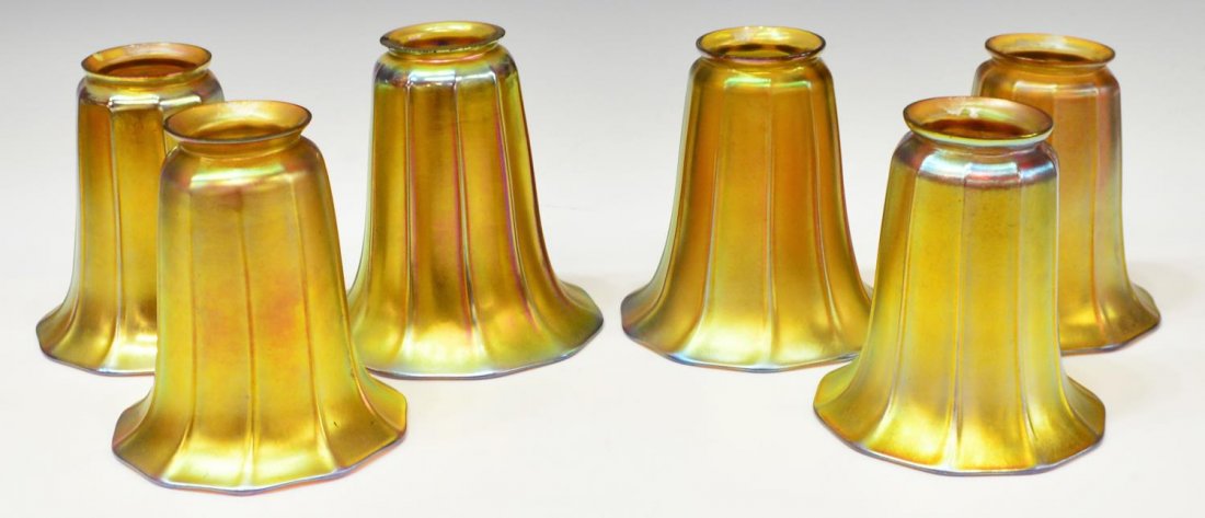 (6) IRIDESCENT GOLD STEUBEN ART GLASS SHADES: (set of 6) Collection of Steuben gold aurene glass shades, ribbed body and flared rim, all marked with Steuben stamp except one, three with flakes to top rim, largest: 5.25"h, 5.25"diam, 4.5lbs total