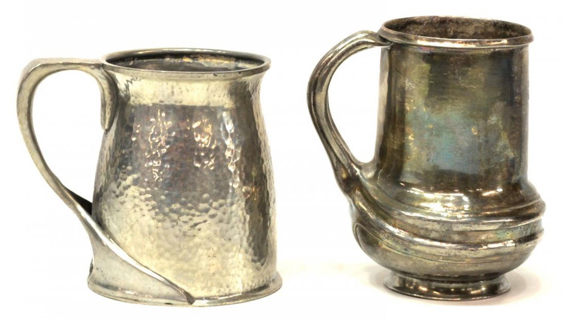(2) ENGLISH TUDRIC PEWTER MUGS: (lot of 2) English Tudric pewter mugs: (1) stamped Tudric 050, possibly Archibald Knox (1864-1933) for Liberty & Company, the arched handle joining the body in a stylized decor, 5"h, 4"w (to handle);