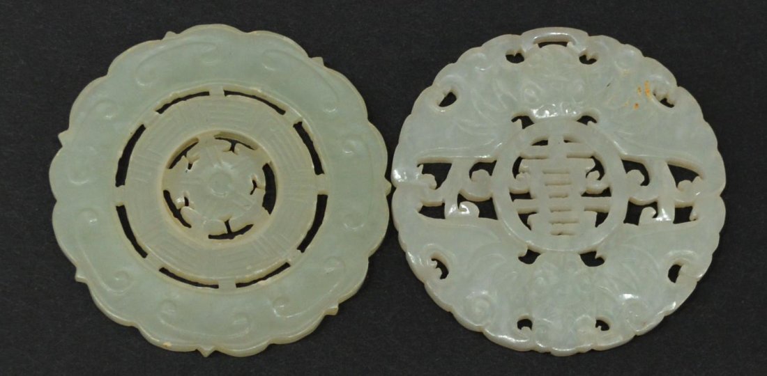 (2) CHINESE JADE PIERCED DISC & JADE ROTATING DISC: (lot of 2) Chinese jade carvings; (1) pierced disc with bats centering an auspicious character, 2.25”diam; (1) jade disc with rotating center, on wood base, disc: 2.20”diam, on base: 3.75”h, .25
