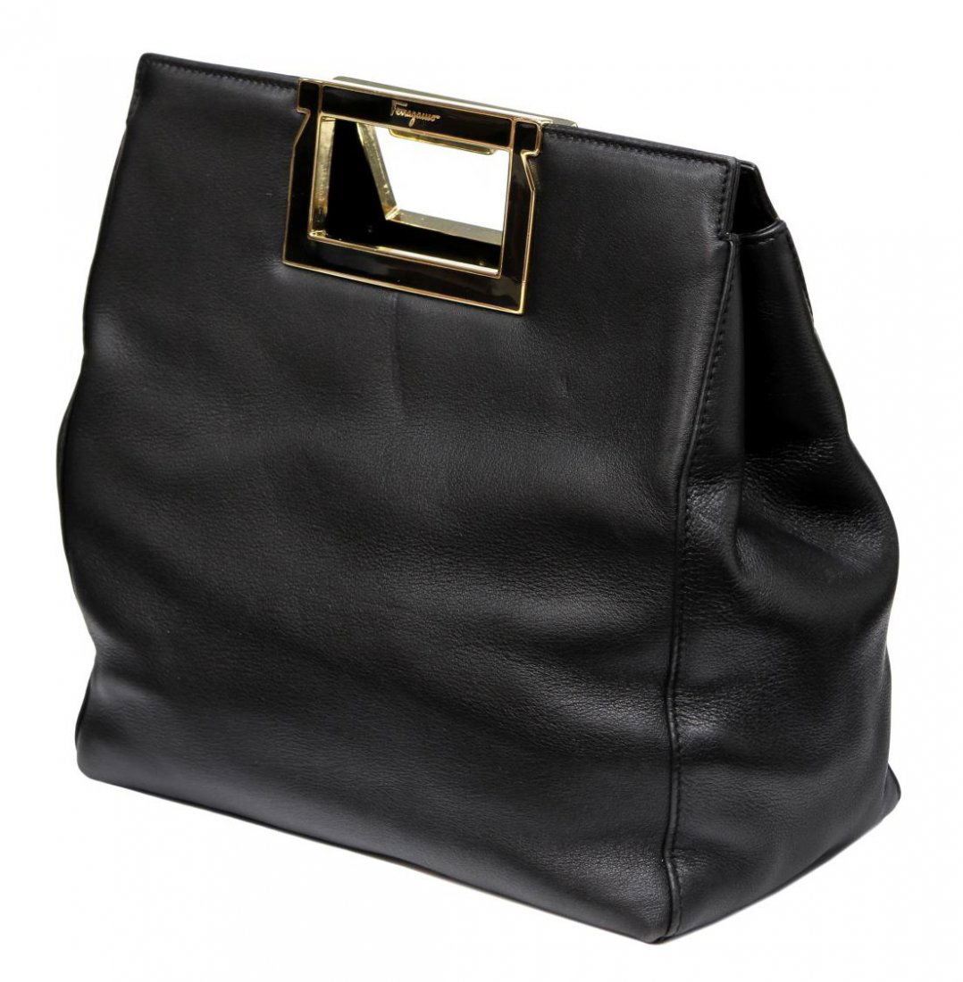 SALVATORE FERRAGAMO SOFT BLACK LEATHER HANDBAG: Salvatore Ferragamo small handbag in soft black leather and gold tone handles, black interior lining with side zipper pocket, retaining dust bag, minor wear to leather, bag: approx 8.75"h, 9.5"w, 4.75