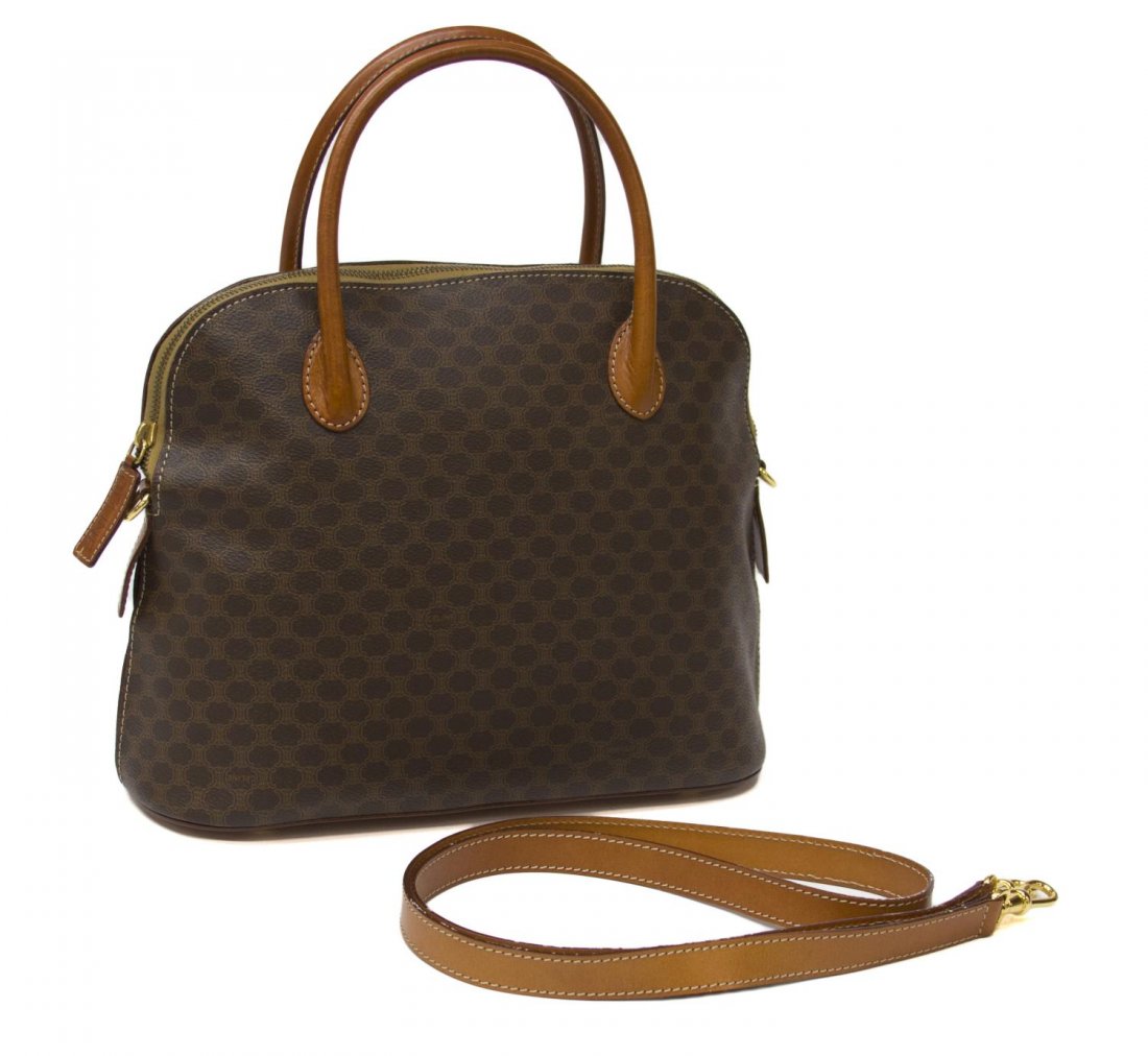 CELINE BROWN MONOGRAM CANVAS HANDBAG: Celine handbag in brown monogram canvas with tan leather handles, detachable shoulder strap, light brown interior with single side zipper pocket, scratch to the base, some wear to straps, bag: approx 