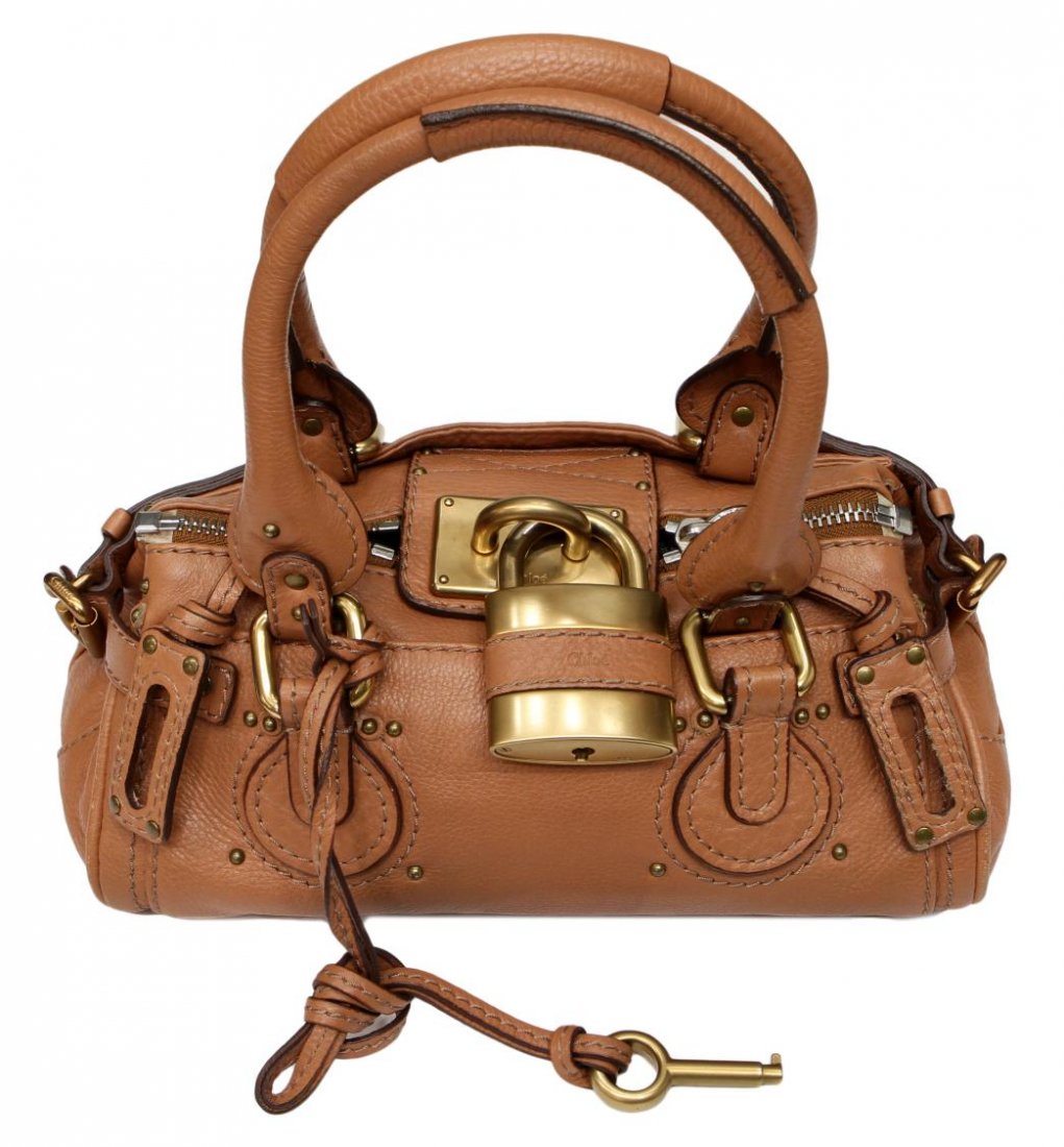 CHLOE PADDINTON LIGHT COGNAC LEATHER HANDBAG: Chloe 'Paddington' in light cognac leather with brushed gold tone hardware, retaining lock and key, set on small metal feet, bag: approx 5"h, 11"l, 5.5"w, 2lbs Start Price: $200.00