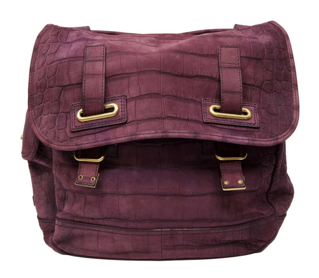 YVES SAINT LAURENT PURPLE SUEDE CROC PRINT BAG: Yves Saint Laurent purple suede bag, embossed crock print, rear exterior pocket, fold over closure opening to black lined interior with both cell and zip pockets, stitched YSL on bottom, retaining lin
