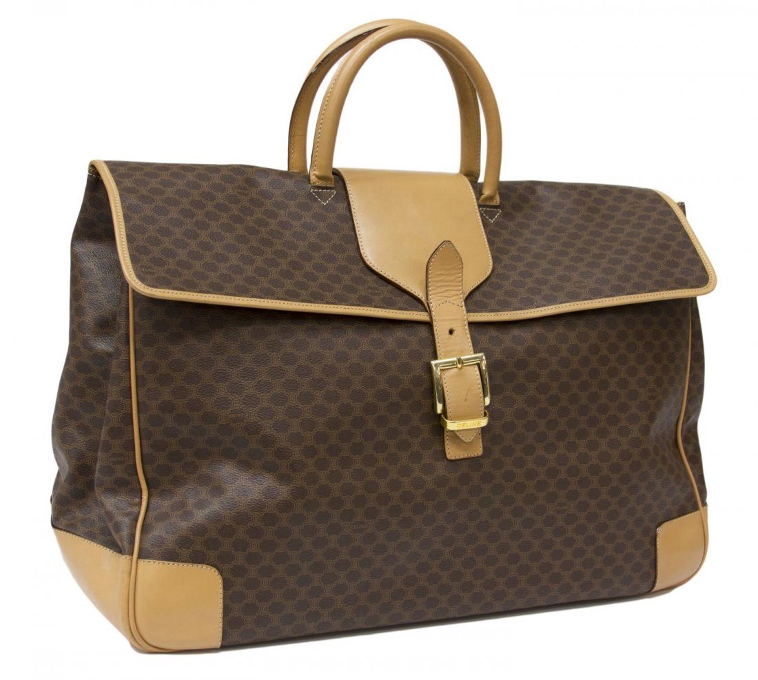 CELINE MONOGRAM CANVAS & LEATHER TRAVEL BAG: Celine travel bag in brown monogram canvas, tan leather double handles and trim, gold tone hardware, large zipper pocket along the back and buckle closure, tan interior, minor wear to the exterior, ba