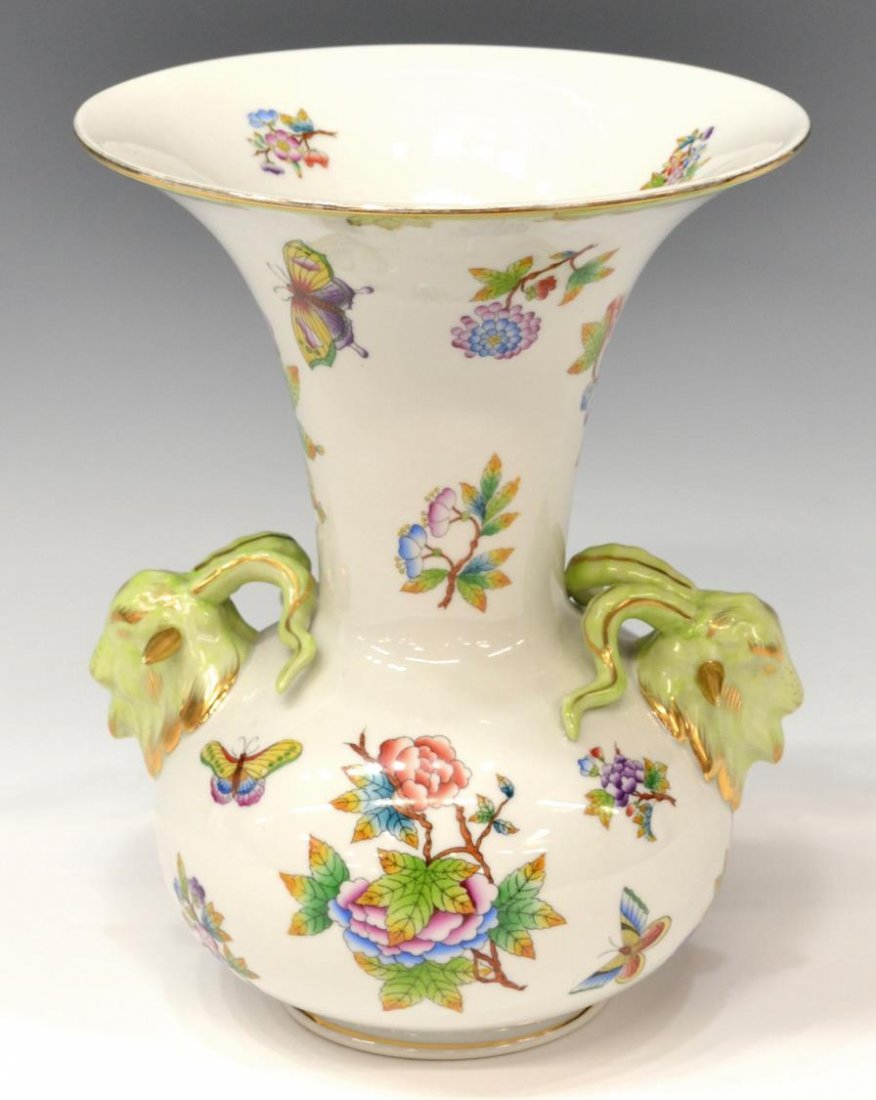 HEREND PORCELAIN QUEEN VICTORIA RAM HEAD VASE: Herend hand painted porcelain vase, Hungary, 'Queen Victoria' pattern with green border, flowers and butterfly on white ground with green border and parcel gilt, two ram heads in relief, 10.5"h, 3.5lb