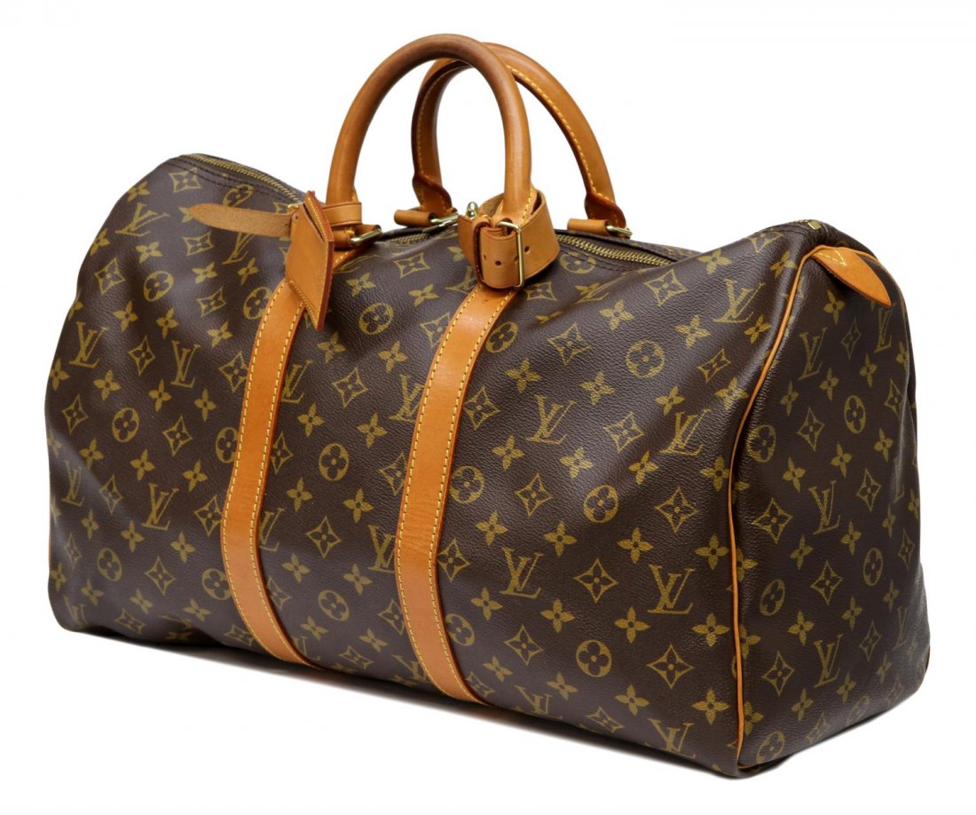 LOUIS VUITTON KEEPALL 45 MONOGRAM TRAVEL BAG: Louis Vuitton 'Keepall' 45 in monogram canvas travel bag, leather trim and luggage tag, patination, bag: approx 10"h, 18"l, 8.25"w, 1.25lbs Start Price: $400.00