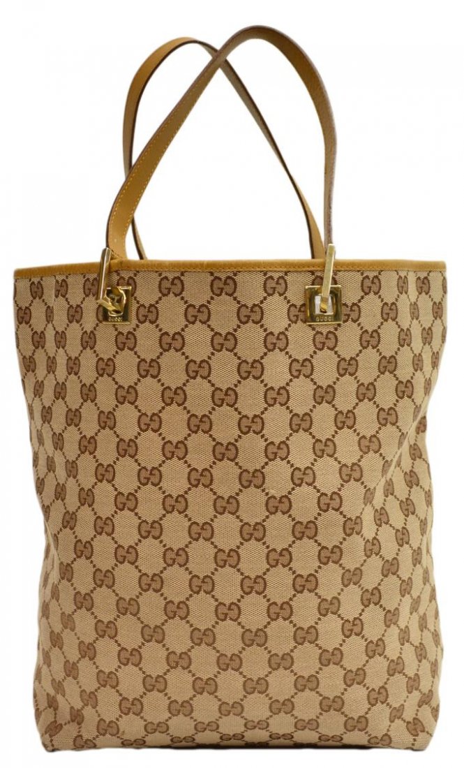GUCCI MONOGRAM CANVAS BROWN & TAN SHOULDER BAG: Gucci monogram canvas shoulder bag in beige, tan leather straps and bottom, interior zippered compartment, wear to leather and some discoloration to interior, bag: approx. 12.25"h, 14.5"w, 4.5"d, 1lb 