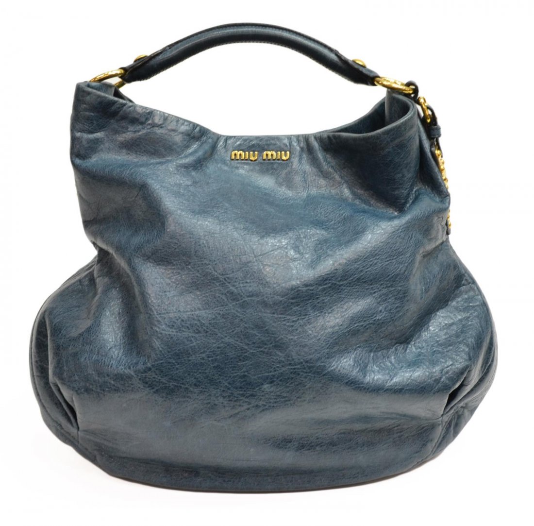 LARGE MIU MIU BLUE SHOULDER BAG: Large Miu Miu shoulder bag, gold tone hardware, zipper and slot pocket on the lined interior, retaining dust bag, bag: approx 14"h, 15"w, 1.75lbs Start Price: $100.00