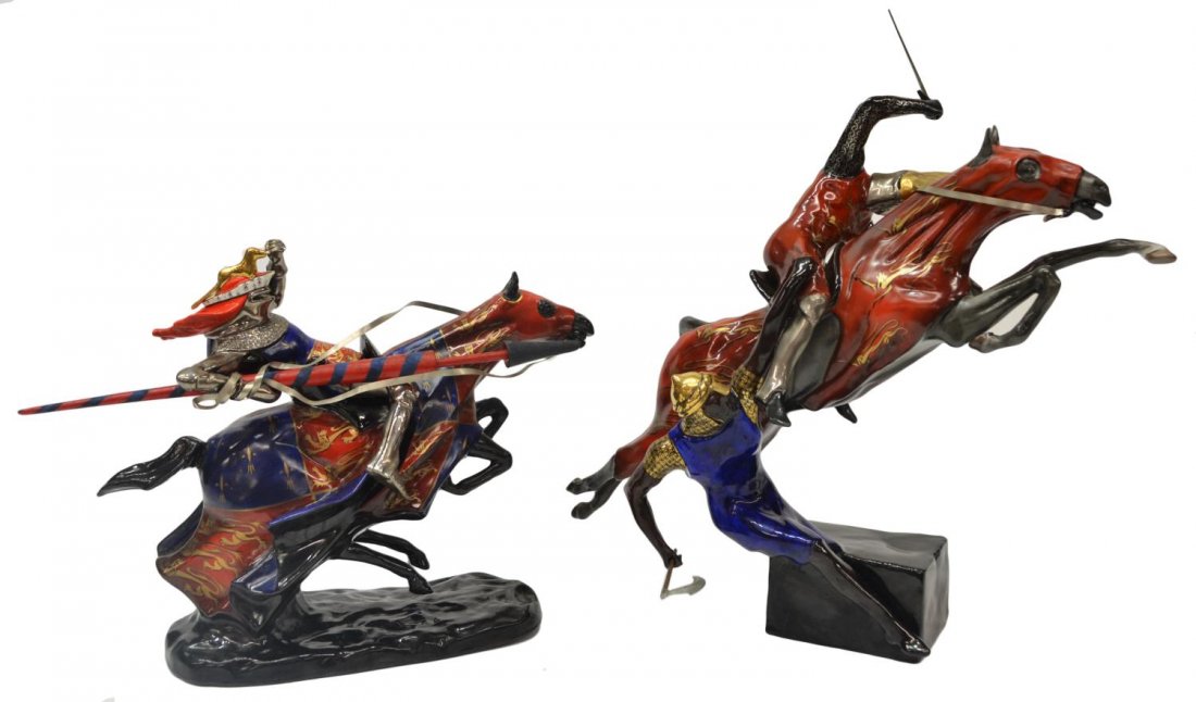 (2) MICHAEL SUTTY PORCELAIN KNIGHTS ON HORSEBACK: (lot of 2) English porcelain figural groups, by Michael Sutty (English, 1937-2003), comprising: (1) depicting a royal knight on a rearing horse, each clad in blue and red garments with gilt decoration