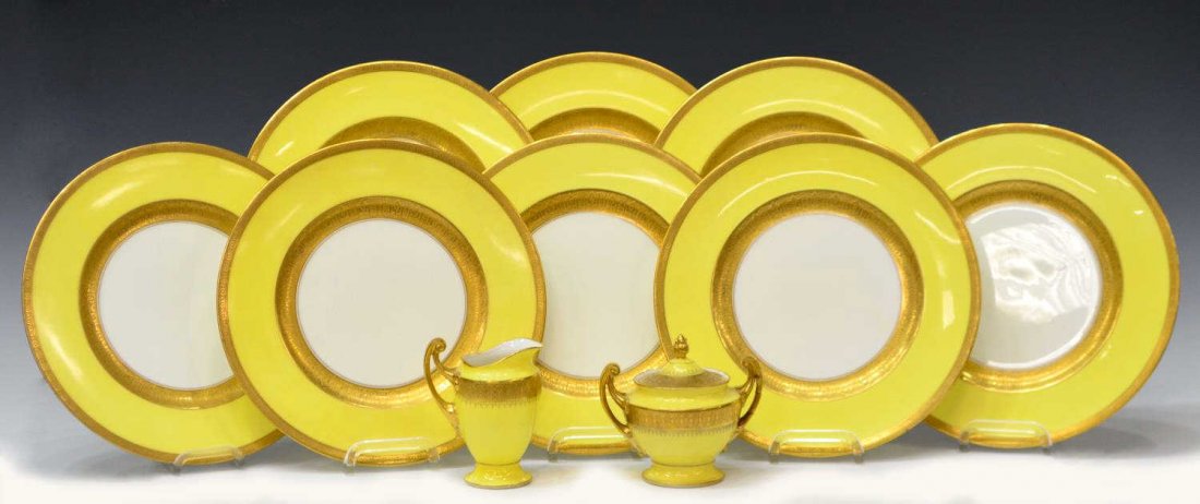 (10) CAULDON ENGLAND PARCEL GILT SERVICE PLATES: (lot of 10) Collection of porcelain plates and serviceware, each having yellow border enclosed by gilt banding, comprising: (8) dinner plates, Cauldon England, slight surface wear, 10.75"diam; (2) Epi