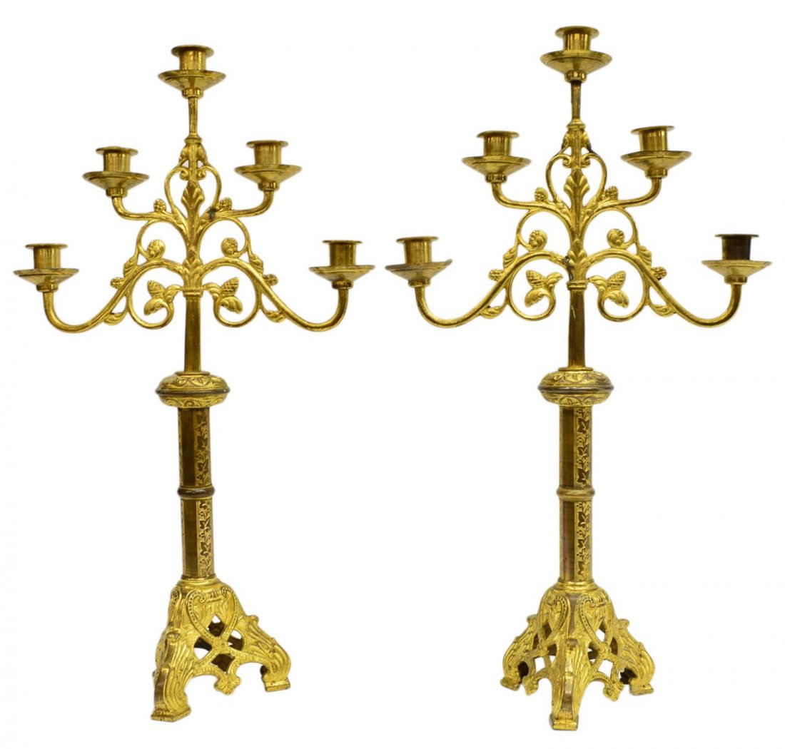 (2) FRENCH GILT METAL ECCLESIASTICAL CANDELABRAS: (pair) French gilt metal altar lights with an ecclesiastical arrangement of acorns and scrolling foliates extending on five arms, on an ornate tri-partite base, some gilt loss, 24"h, 13.5"w, 9.25lbs S