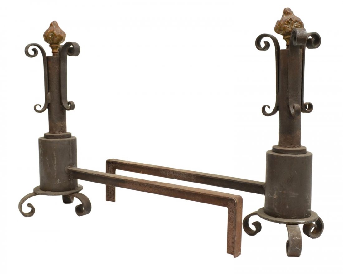 (2) SPAIN WROUGHT IRON ANDIRONS: (pair) Wrought iron andiron, central standard issuing three scrolled arms raised on scrolled feet, accented with a flower bud finial, 19.5"h, 23"l, 17.5lbs total Start Price: $200.00