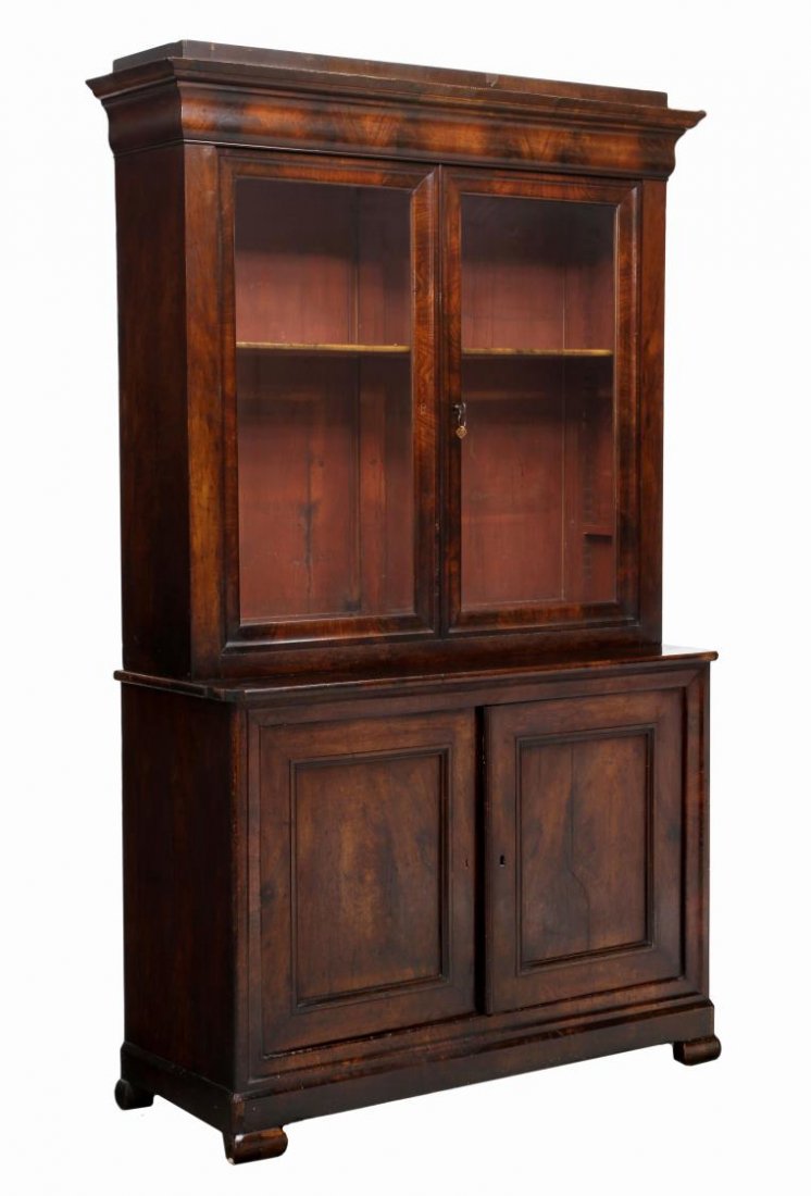 SPANISH MAHOGANY DISPLAY BOOKCASE: Spanish mahogany display cabinet or bookcase, Barcelona, 19th c., having a stepped cornice over two glass doors opening to adjustable height shelves, the lower cabinet with two doors, all rising on br