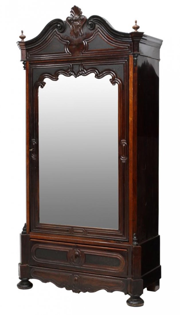 SPANISH MAHOGANY MIRRORED ARMOIRE, C. 1900: Spanish mahogany armoire, c. 1900 having a foliate arched crest over a single mirrored door two lower drawers with one appearing as trim, rising on bun feet, 97"h, 48"w, 23.25"d Start Price: $300.00