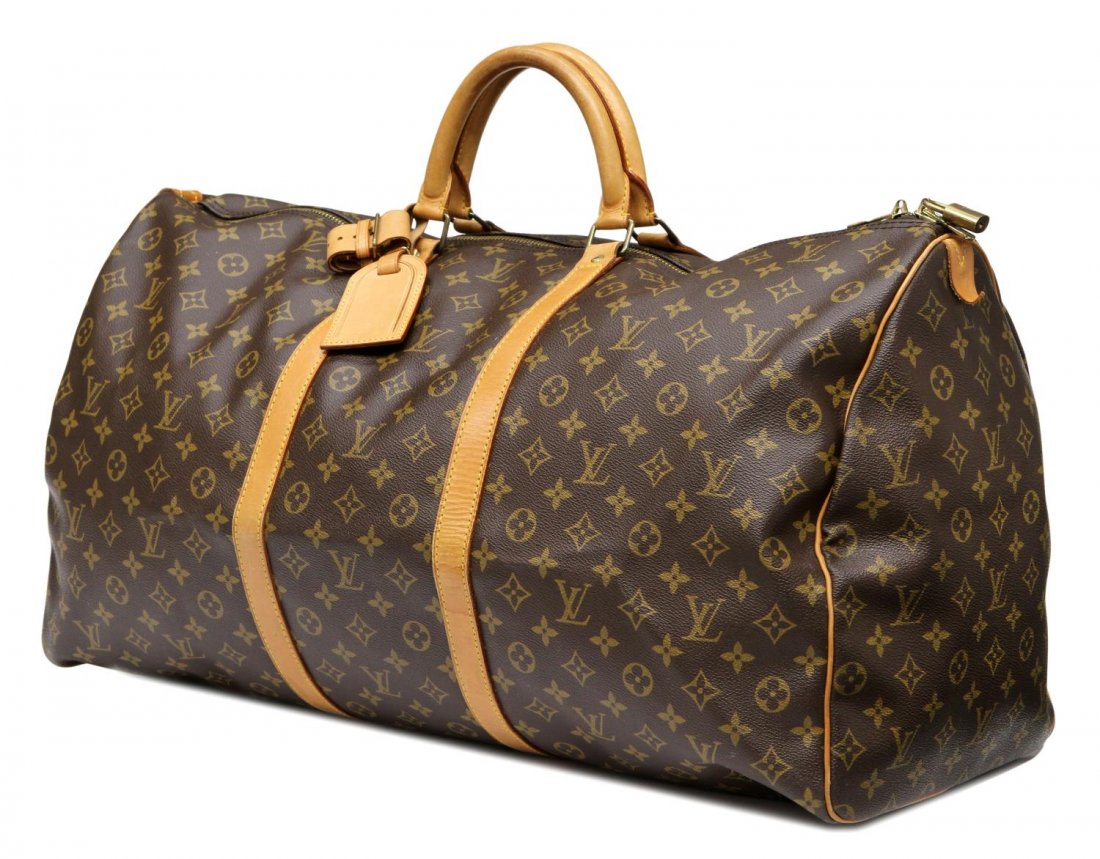 LOUIS VUITTON MONOGRAM CANVAS KEEPALL 60 DUFFEL: Louis Vuitton "Keepall 60" travel duffle bag in monogram canvas, leather handles and trim, luggage tag and lock, some patination and wear, bag: approx 13.5"h, 24"w, 11"d, 2.75lbs Start Price: $400.00