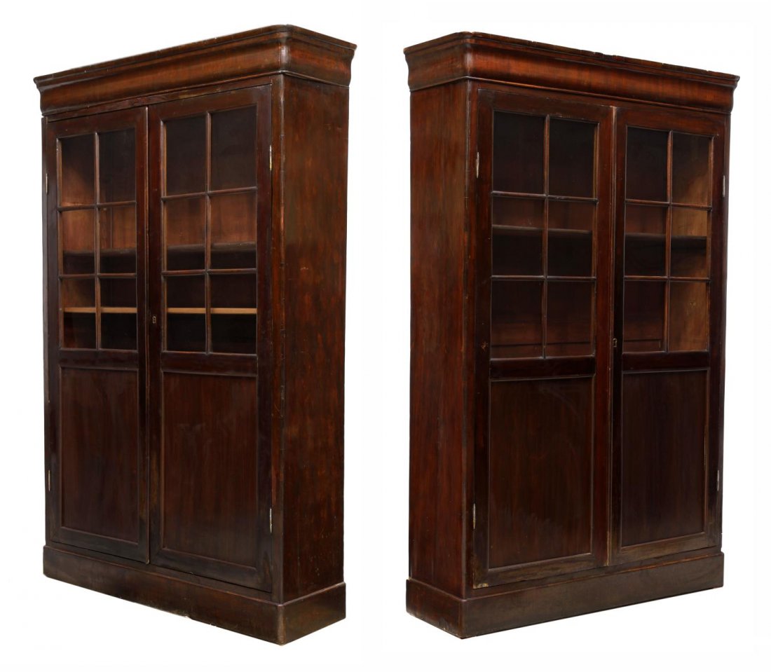 (2) ANTIQUE SPANISH MAHOGANY BOOKCASES: (pair) Spanish mahogany bookcases, each having a pair of faux mullion doors over blind lower section, shelved interior, approx 77"H, 49"W, 14"D, Start Price: $600.00