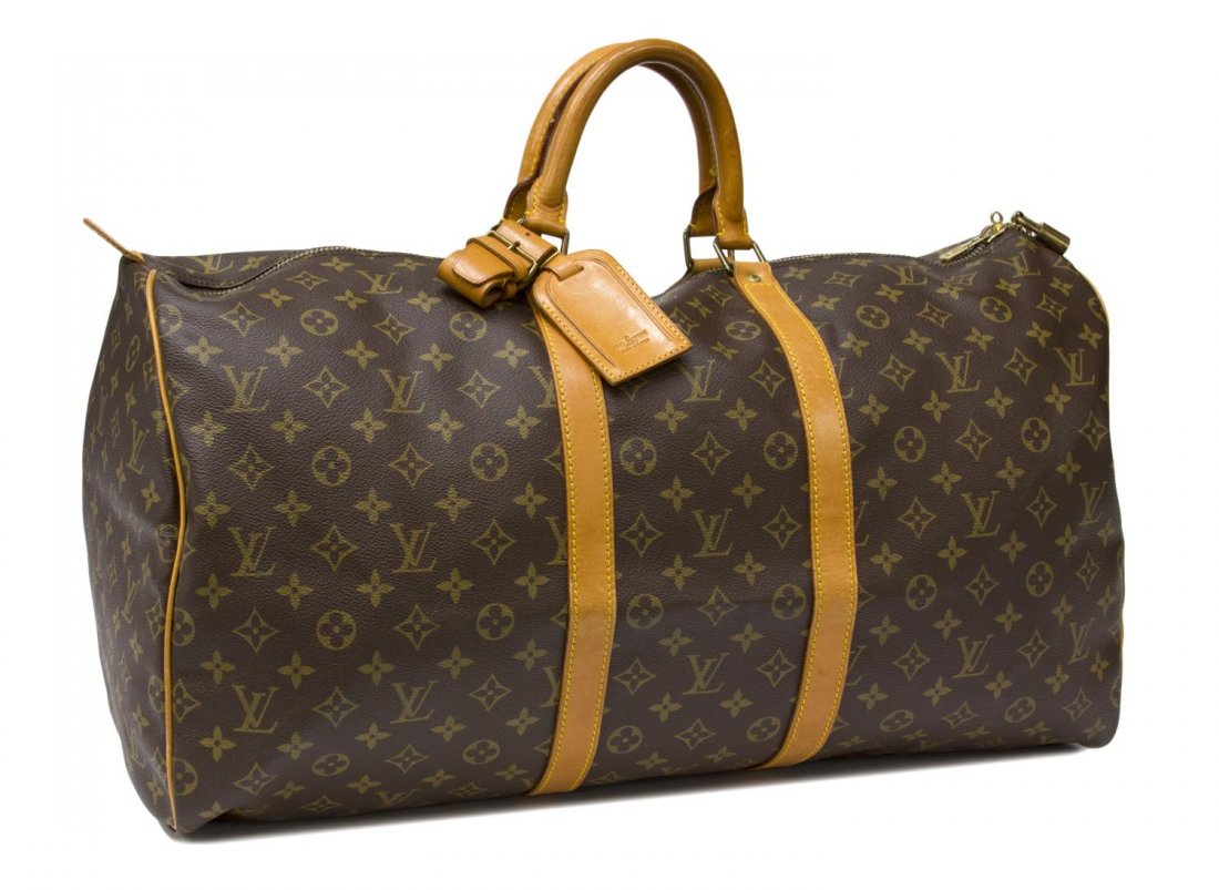 LOUIS VUITTON KEEPALL 50 TRAVELING DUFFLE BAG: Louis Vuitton "Keepall 50" travel duffle bag in monogram canvas, luggage tag and lock, lacking keys, some wear and discoloration to leather, patination, bag: approx 12"h, 22"w, 10"d, 2lbs Start Price: