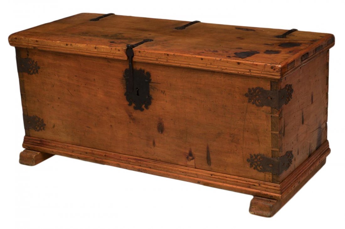 SPANISH COLONIAL SABINO WOOD TRUNK: Spanish Colonial sabino wood trunk, Mexico, 18th c., having a single board top with decorative hand forged iron hinges, a single lock with large shaped lock plate, an interior cupboard, rising on shoe