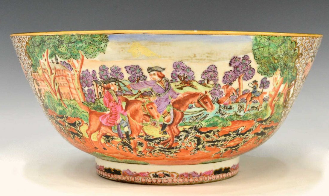 CHINESE EXPORT ENAMELED PORCELAIN CENTER BOWL: Decorative Chinese export enameled porcelain center bowl, Western scenes of mounted hunters and packs of hounds in pursuit of a fox, ornate gilt and floral decoration, gilt rim with some loss, 6.5"h, 