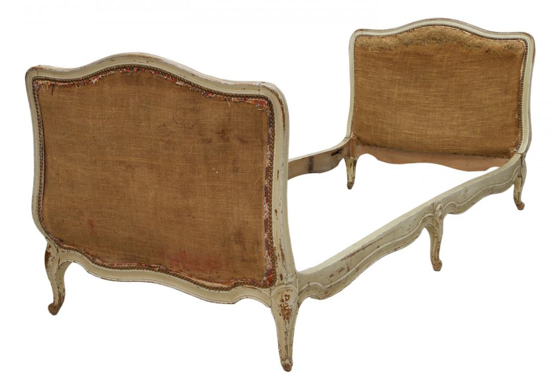 ANTIQUE FRENCH LOUIS XV STYLE DAY BED: French Louis XV style day bed in worn white paint, late 19th c. the original upholstery removed, rising on cabriole legs with scrolled feet, end boards: 32.5"h, 34"w, rails: 73.5"l Start Price: $200.0