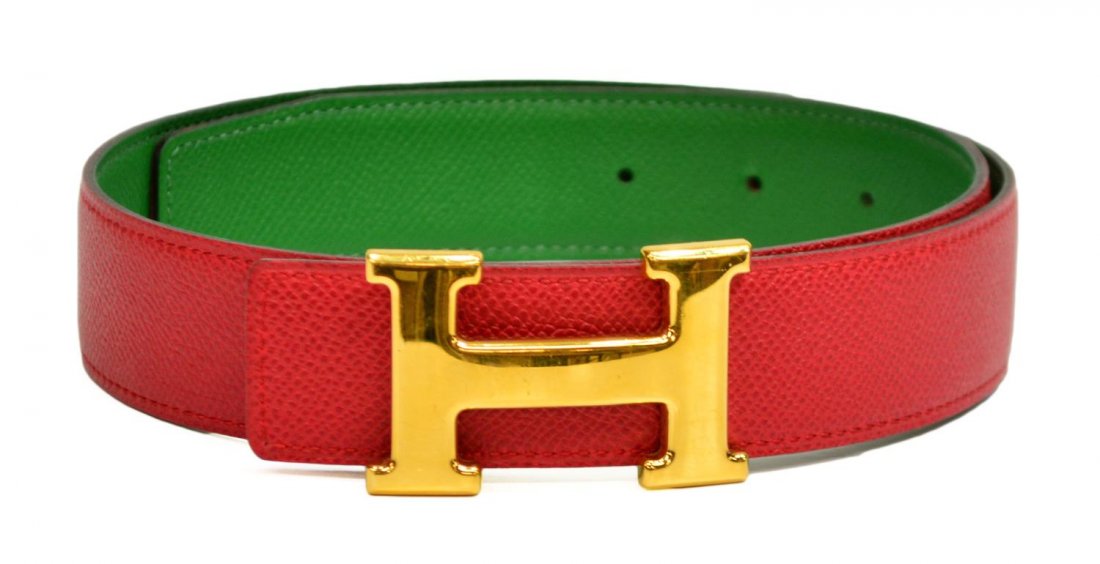 HERMES RED LEATHER & GOLD 'H' LOGO BELT: Hermes red leather belt, "H" gold tone buckle, green interior, marked and stamped, retaining box, surface wear to buckle, size 70, .25lbs Start Price: $200.00
