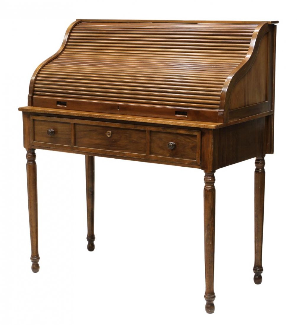 SPANISH ROLL TOP DESK ON CYLINDRICAL SUPPORTS: Roll top desk, Spain, the tambour top opening to a sectioned interior, above a single drawer, raised on cylindrical supports, 48"h, 42.5"w, 21"d Start Price: $200.00