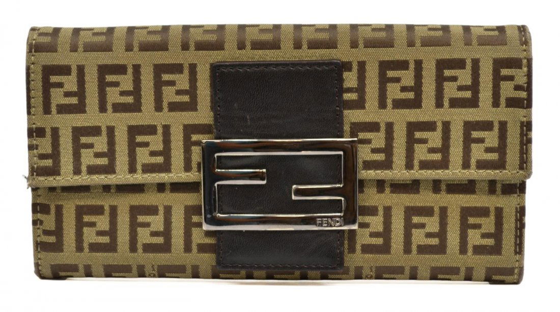 FENDI BEIGE MONOGRAM CANVAS LONG WALLET: Fendi wallet in beige monogram canvas, silver tone hardware, brown leather trim interior with five compartments including one zipper pocket and card slots, wallet: approx 4"h, 7.5"w, 1"d, .25lbs Start