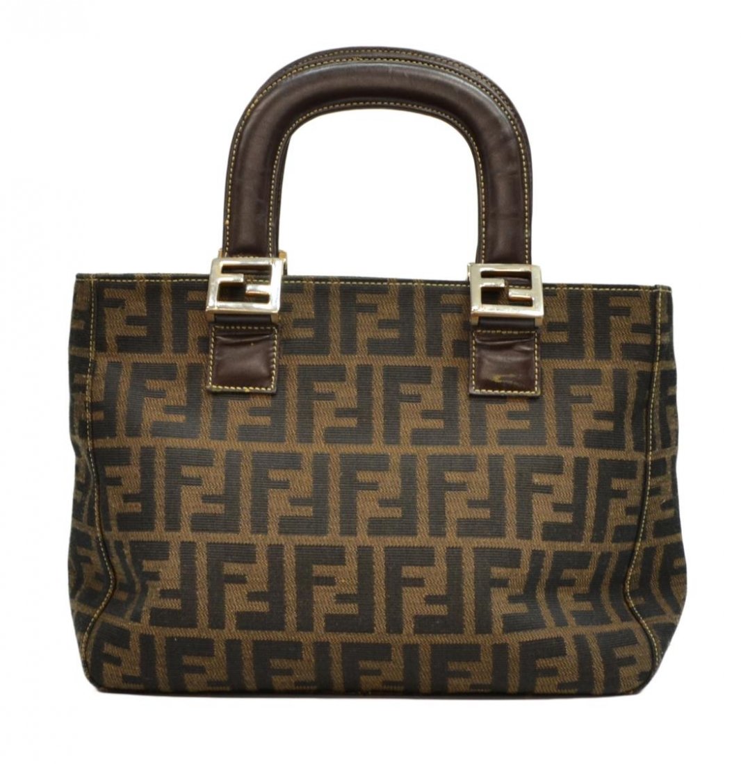 FENDI ZUCCA MONOGRAM CANVAS HANDBAG: Fendi handbag in Zucca monogram canvas, leather handles, silver tone hardware, zipper closure, Fendi lining, interior with side zipper pocket, handles showing use, 8.5"h, 11"w, 4.25"d, 1lbs (0091C) St