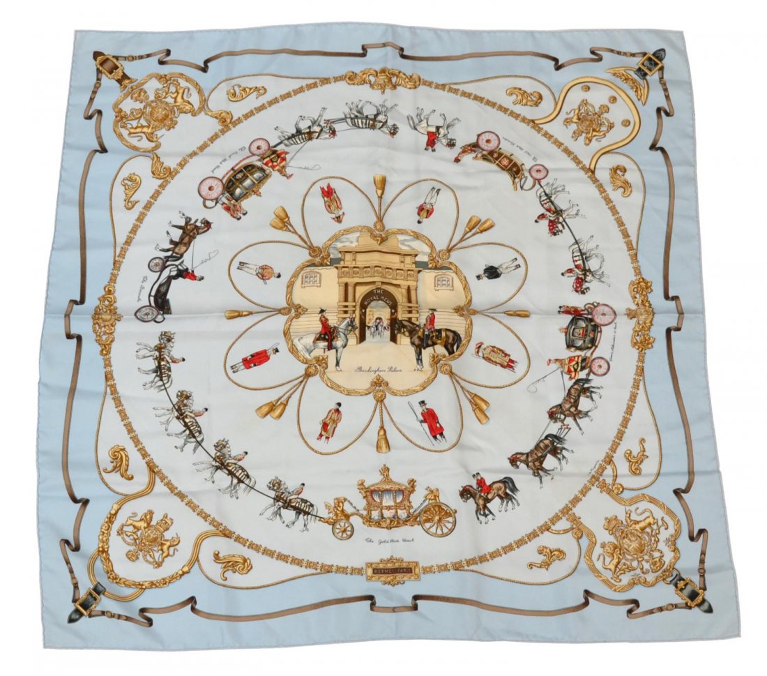 HERMES THE ROYAL MEWS LIGHT BLUE SILK SCARF: Hermes 'The Royal Mews' silk scarf in light blue, depicting a central design of the Buckingham Palace entry way and different stage coaches, border of gold links and royal crests, hand sewn edges, sca