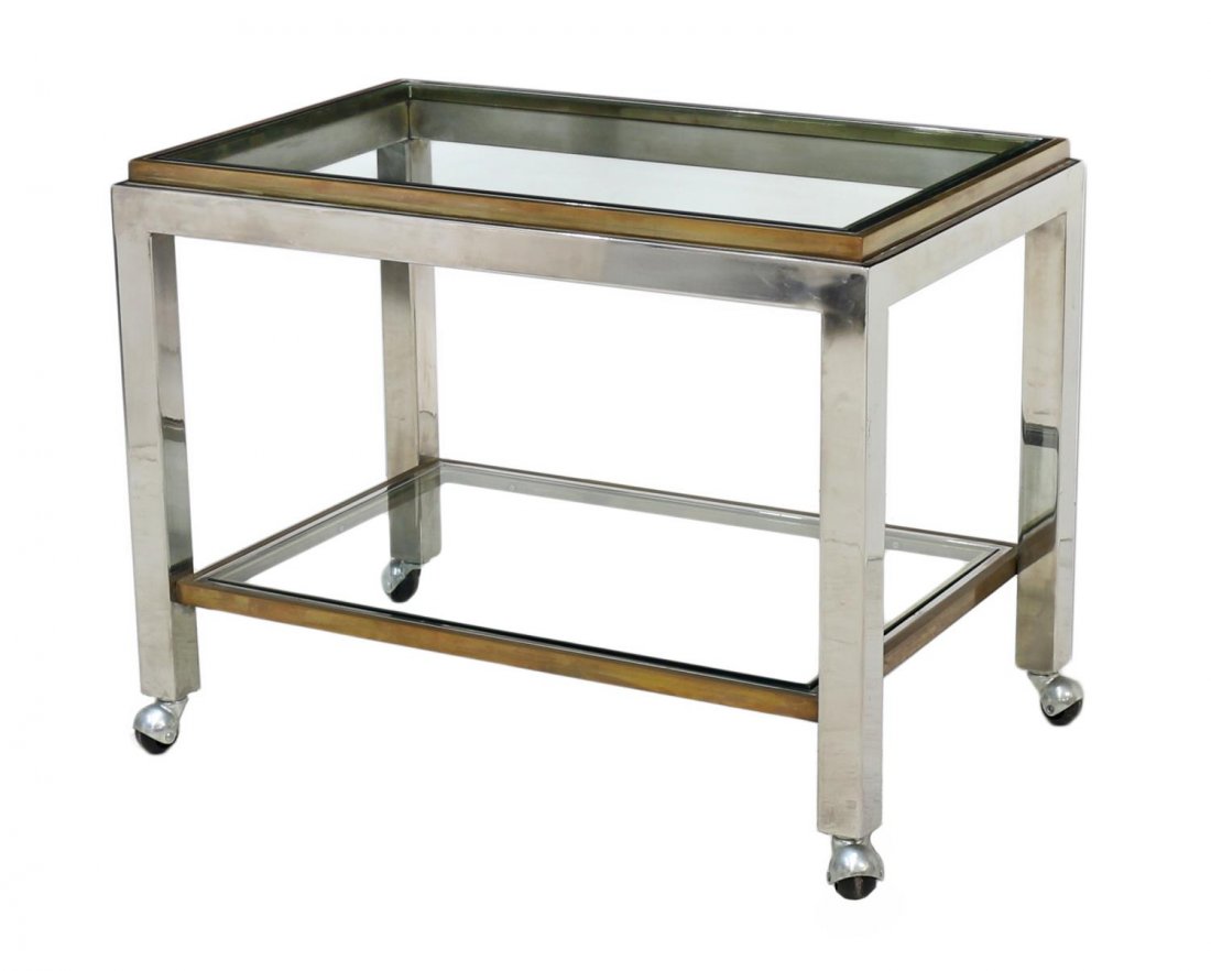 ITALIAN MODERN GLASS & METAL TIERED SERVICE CART: Italian modern design service cart, design by Romeo Rega, c. 1970, two glass tiers held by the mixed metal frame, moving on casters, some surface wear, approx 22"h, 28.25"w, 18"d Start Price: $150.00