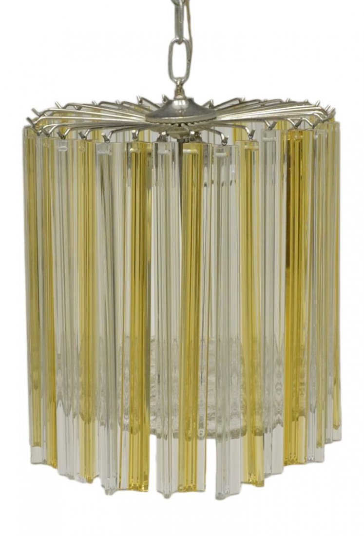 ITALIAN MID-CENTURY VENINI ART GLASS CHANDELIER: Italian mid-century modern three-light chandelier, c. 1960, design by Venini, circular silver tone metal frame hung with Murano art glass amber and clear 'Triedri' components, textured glass plate on 