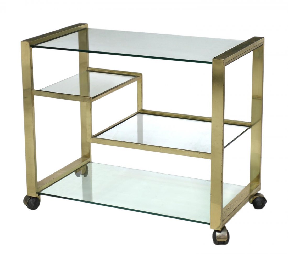 ITALIAN MODERN DESIGN BRASS & GLASS SERVICE TROLLY: Italian modern design rolling service cart, c. 1970, in the manner of Willie Rizzo (Italian, 1928-2013) a brass frame with tiered shelving, rolling on casters, spotting, surface wear, approx. 26"h, 31