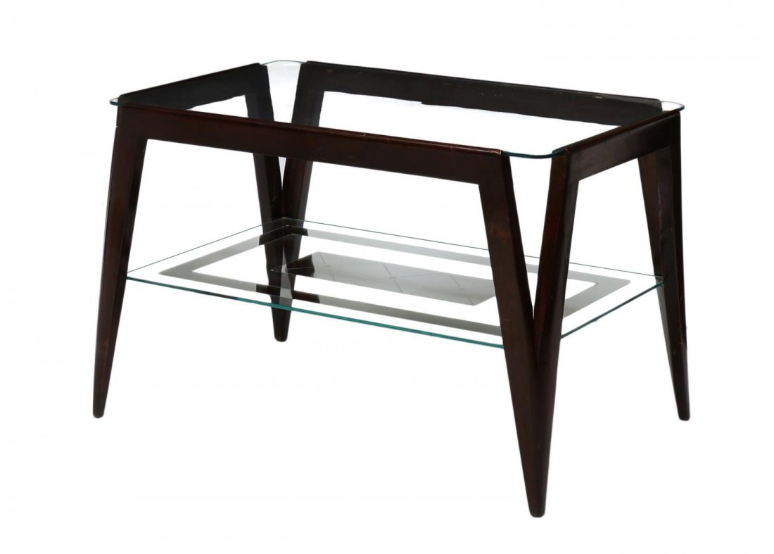 ITALIAN MID-CENTURY MODERN WOOD GLASS COFFEE TABLE: Italian mid-century modern coffee table, c. 1950, angled openwork legs in a mahogany finish, support a colorless glass top, above a lower glass and mirrored shelf, some loss of silver, approx. 19.5"h,