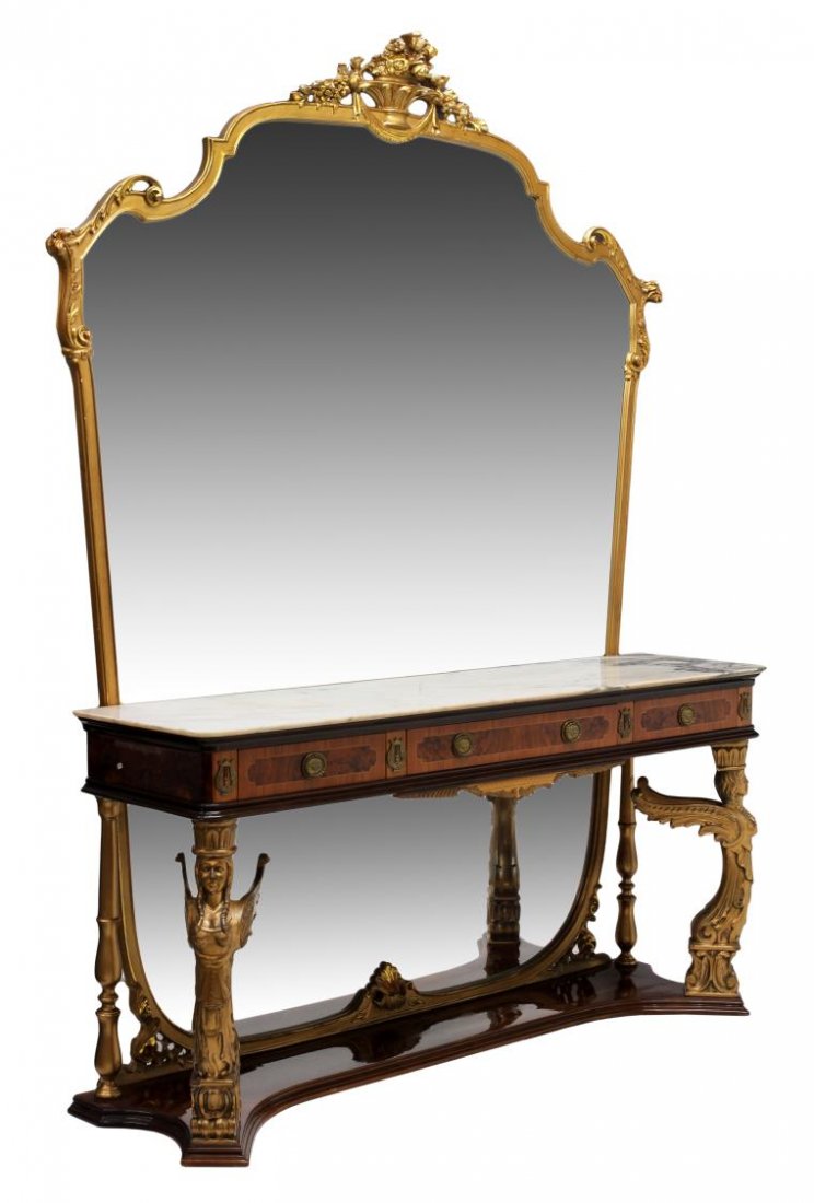 EMPIRE REVIVAL BURL & GILT WINGED FIGURAL CONSOLE: Empire Revival parcel gilt burlwood console table and mirror, c. 1960's, a floral basket surmounting the long, full length mirror, thin marble top on the table having three aligned drawers with banded