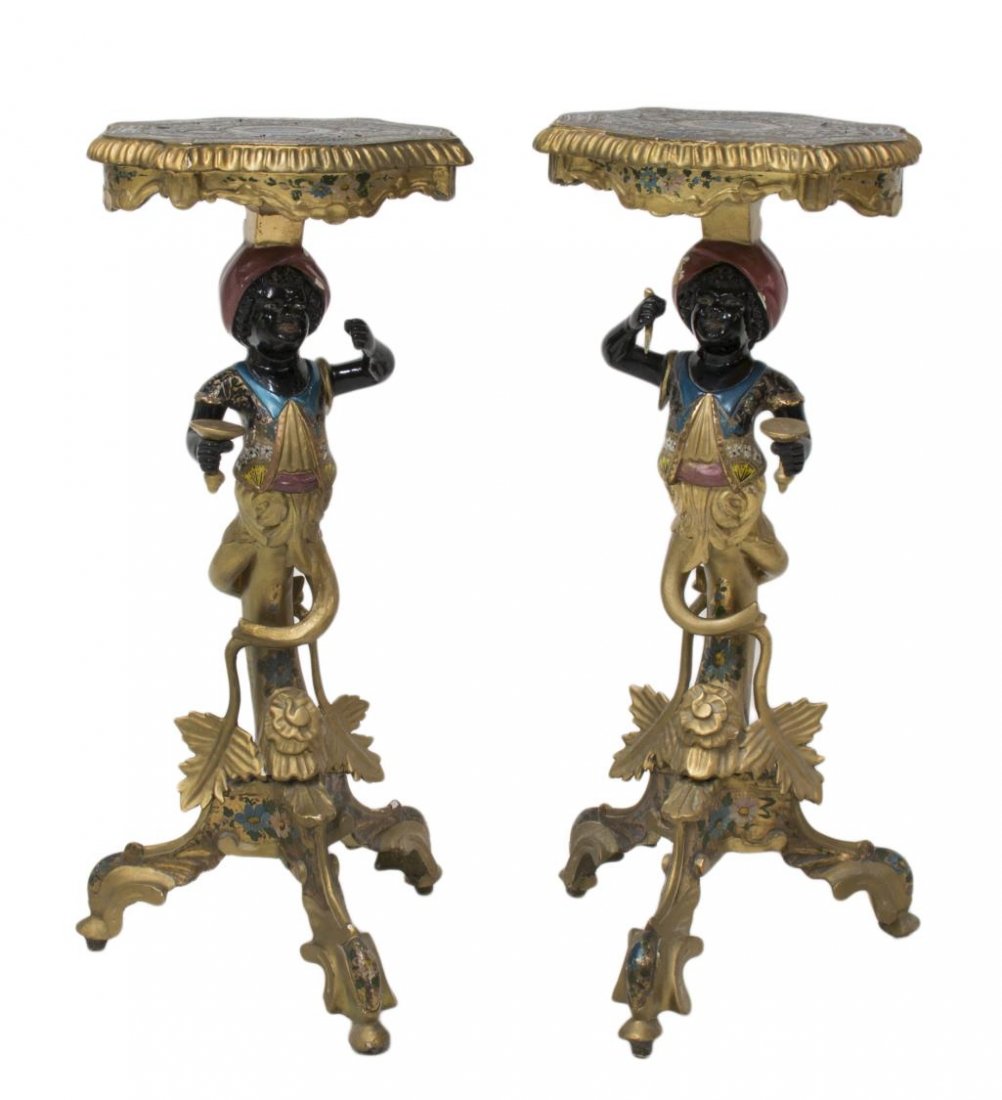 (2) ITALIAN PARCEL GILT BLACKAMOOR TABLES: (lot of 2) Italian parcel gilt polychrome tables, first half 20th c., the shaped tops held by Blackamoor forms on tripartite bases, paint loss, one figure lacking held item, 29"h, 12.75"w, 12.75"d Sta