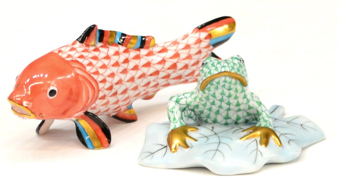 (2) HEREND FISHNET PORCELAIN FROG & FISH: (lot of 2) Herend porcelain figurines, both in the fishnet pattern, Hungary, including: (1) frog on lily pad, in green with gilt accents, 1.5"h, 3"w; (1) rust fish with blue, black, and gilt accents,