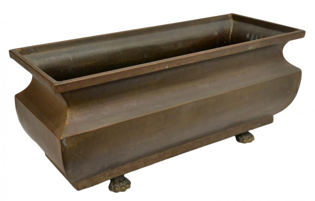 ANTIQUE COPPER FLOWER POT ON PAW FEET: Antique copper flower pot, 19th c., rectangular form body raised on four gilt metal paw feet, interior having patina and surface wear throughout, 10"h, 23.75"l, 9.75"d, 11.5lbs Start Price: $80.00