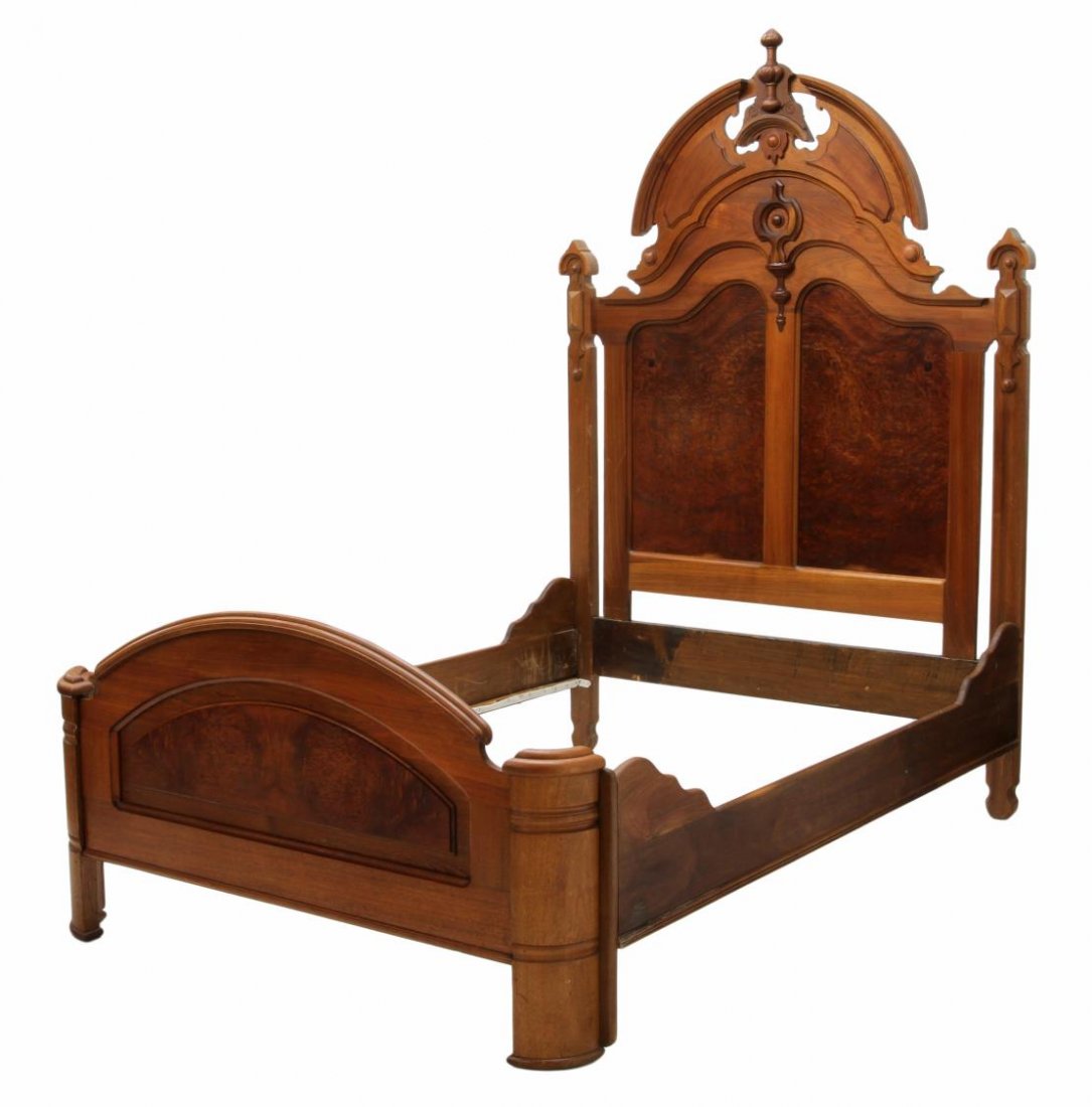 AMERICAN RENAISSANCE REVIVAL HIGHBACK BED: American Renaissance Revival walnut bed, c. 1875, the headboard finial topped arched cornice with applied carved decoration, a curved end foot board, headboard: 93"h, 62.75"w, inside: 80"l, 61.5"d Sta
