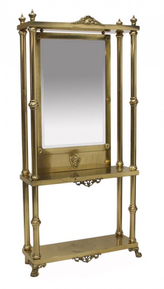 BRASS MIRRORED HALL TREE: Brass hall tree, 20th c., having a beveled rectangular mirror flanked with tubular columns continuing to the lower tier, and rising on paw, 81.5"h, 41"w, 13"d Start Price: $200.00