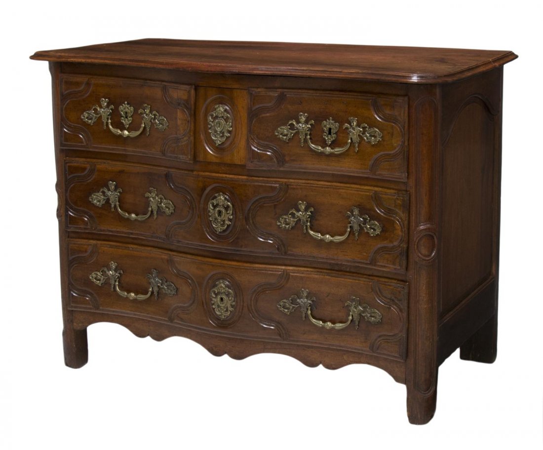 EARLY 19TH C. LOUIS XV STYLE CARVED WALNUT COMMODE: Louis XV style carved walnut commode, early 19th c., the serpentine case fitted with two small and two large drawers, molded and carved detail throughout, later figural hardware, approx 36.25"h, 49.75