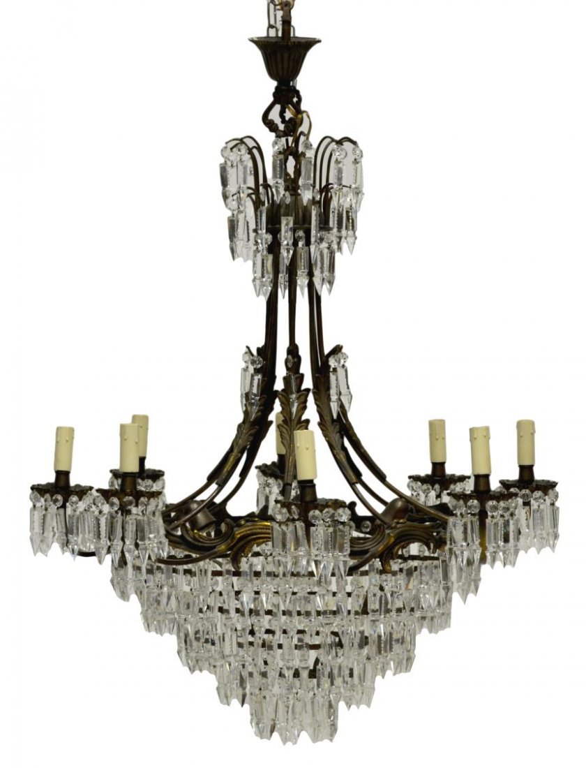 CONTINENTAL EMPIRE STYLE WEDDING CAKE CHANDELIER: Continental Empire style gilt bronze finish and crystal prism twelve- light wedding cake chandelier, 20th c., central ring having scrolled foliate relief, issuing eight arms holding faux candle holder