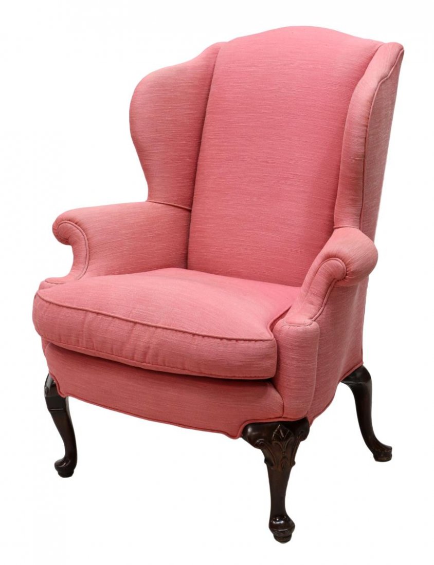 QUEEN ANNE STYLE UPHOLSTERED WINGBACK CHAIR: Queen Anne style wingback chair in later pink rose upholstery, a single seat cushion, raised four legs, 44.5"h, 36"w, 25"d Start Price: $100.00