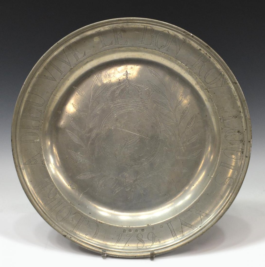 18TH C. LOUIS XVI WRIGGLEWORK PEWTER CHARGER: Large French pewter charger, 'A Dieu Vive Le Bon Roy Louis XVI 1789', some surface wear, touch marks, including crowned rose as pictured, 17.75"diam, 5.5lbs *Provenance: From the estate of Don Yarton 