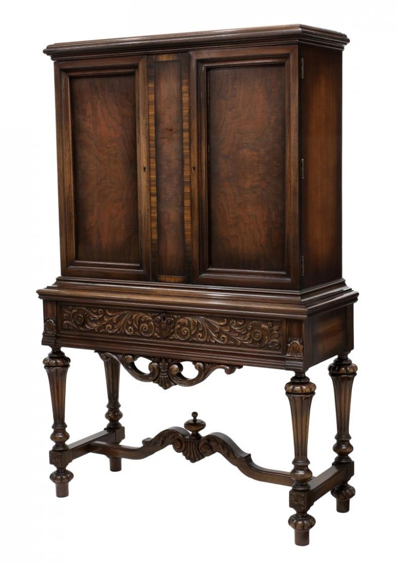 MOHLHENRICH CLOSED FRONT CHINA CABINET, 1920'S: Closed front china cabinet by The Mohlhenrich Furniture Company, Baltimore, c. 1920, a stepped cornice over two door opening to shelved storage, the long frieze drawer with applied foliate carving ove
