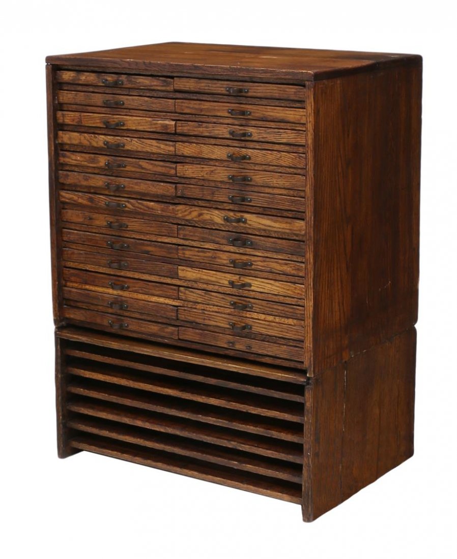 AMERICAN OAK PRINTERS CABINET: American oak two part printers cabinet, c. 1900, the upper part with 26 tin lined drawers, the lower part part with six open shelves, overall: 35"h, 25.5"w, 17.25"d Start Price: $150.00
