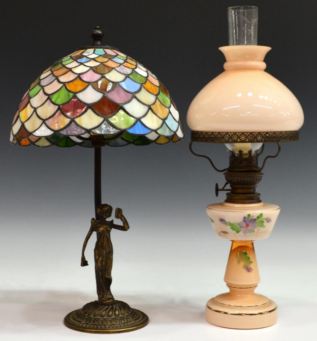 (2) FIGURAL BRONZE FINISH & BANQUET TABLE LAMPS: (lot of 2) Lamps: (1) figural gilt metal table lamp having a stained and slag glass shade, approx 17"h; (1) painted glass banquet lamp, now electrified, in need of wiring, 17.75"h; 6.75lbs total (133)